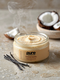 Pure Glow and Flow Jar of coconut vanilla sugar body scrub with coconuts and vanilla beans on a stone surface