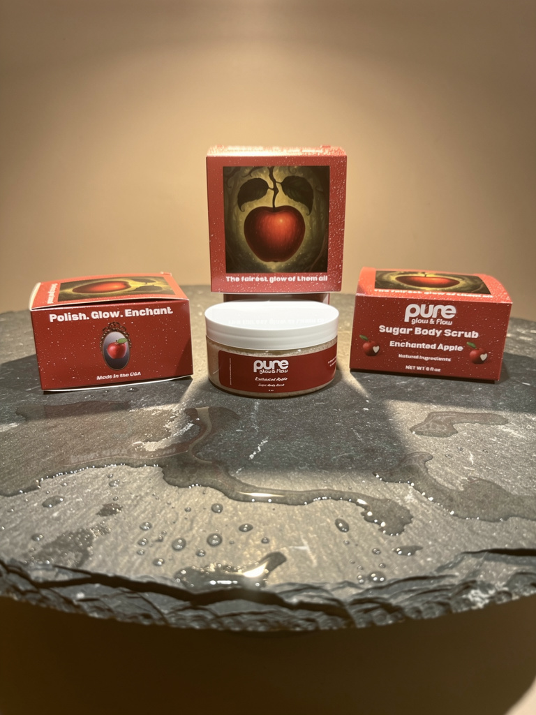 Pure Glow and Flow Sugar Body Scrub container in the sent Enchanted Apple, on a dark surface