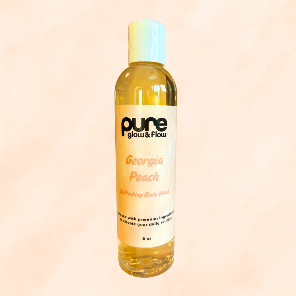 Bottle of 'Georgia Peach' body wash by 'pure glow & flow' on a peach background