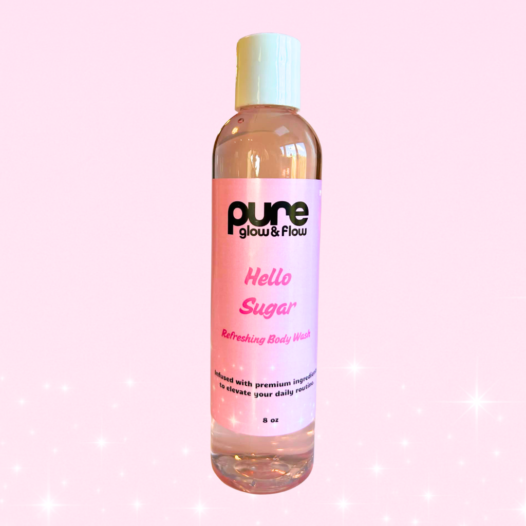 Bottle of Pure Glow and Flow's 'Hello Sugar' refreshing body wash with a pink label on a pink background
